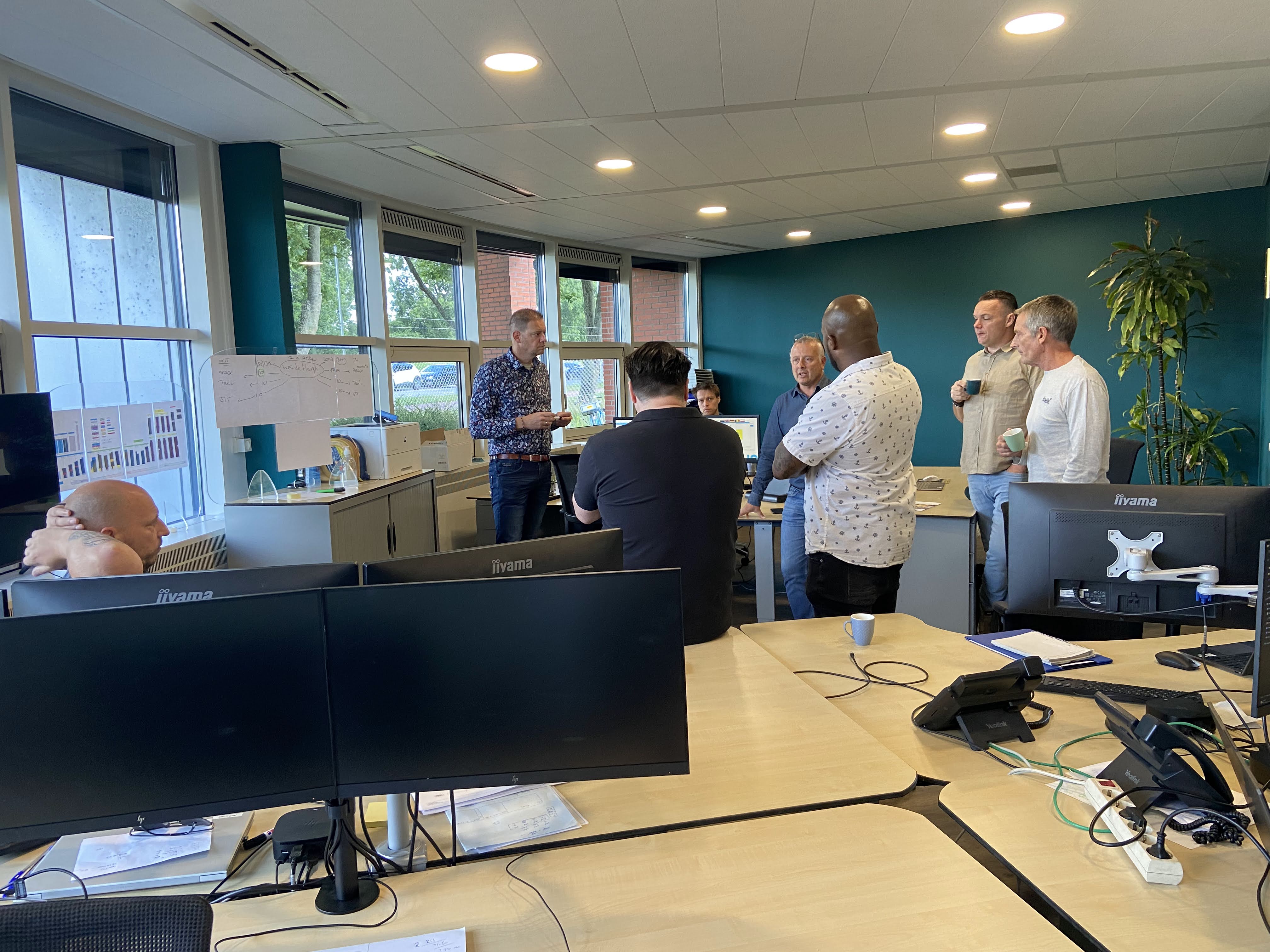 Rusiru in a workshop discussing a system screen