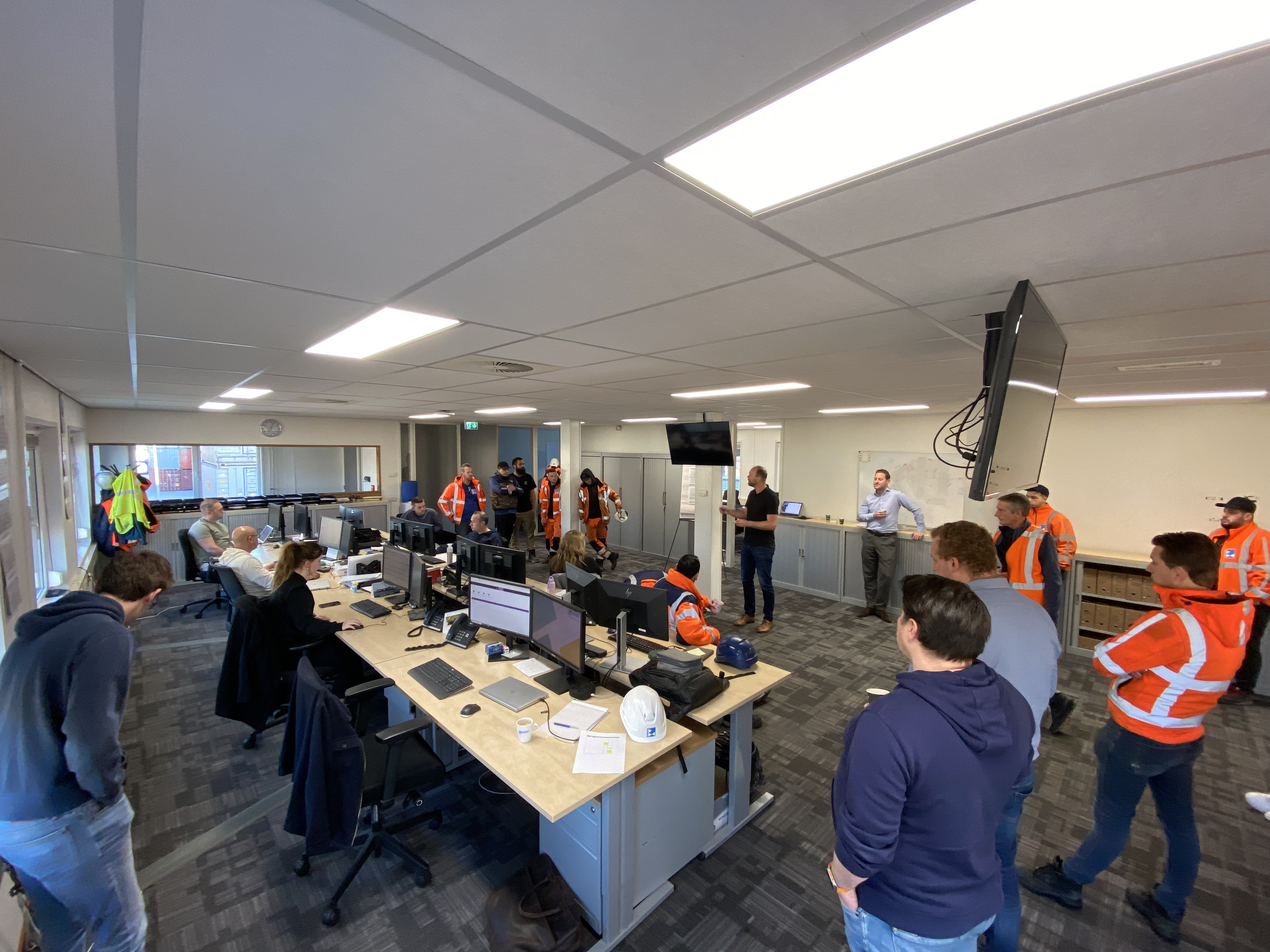 Office environment with group discussion